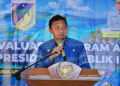 Bupati Tojo Una-Una Ilham Lawidu saat menyampaikan sambutan pada pembukaan Rapat Koordinasi (Rakor) Evaluasi Program Asta Cita di Reconnect Buka Buka Island, Kecamatan Ampana Tete, Jumat (11/9/2026).